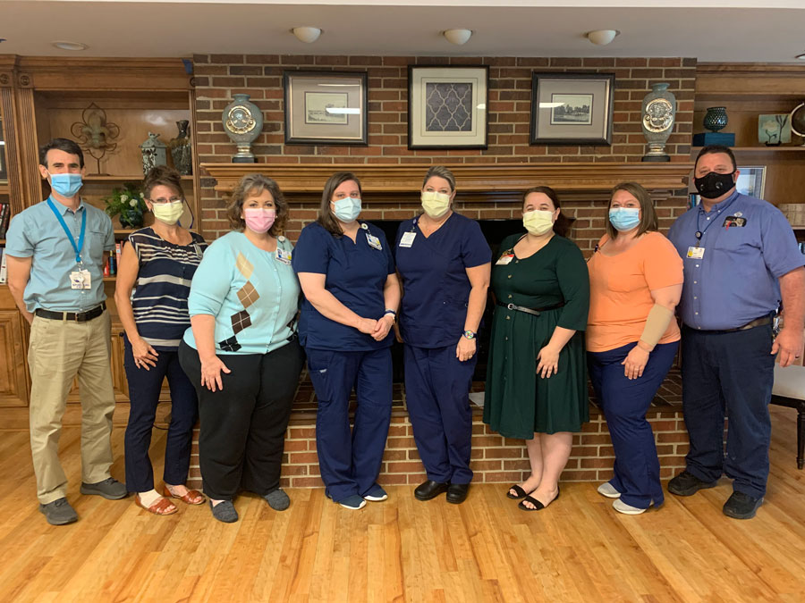 Some of the Highland Hills staff who played a key role in responding to the July 15 fire and subsequent resident needs are, from left to right: Craig Topple, chaplain; Toni Roark, activities coordinator; Beth Dillard, front office coordinator; Alicia Hooper, clinical manager; Mandi Haslett, director of nursing; Hannah Baker, activities coordinator; Holly Baddeley, resident ambassador; and Brian Colley, maintenance manager